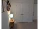 Hallway with a small table and lamp near double doors at 558 Pendleton Dr, Moncks Corner, SC 29461