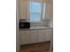 Charming kitchen area with white cabinets, granite countertops, subway tile backsplash, and modern appliances at 558 Pendleton Dr, Moncks Corner, SC 29461