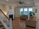 Cozy living room featuring hardwood floors, a fireplace, and plenty of natural light at 558 Pendleton Dr, Moncks Corner, SC 29461