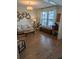 Bright living room with hardwood floors, neutral decor, and a large window overlooking the yard at 558 Pendleton Dr, Moncks Corner, SC 29461