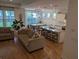Bright open concept with hardwood floors and large windows that fill the space with natural light at 558 Pendleton Dr, Moncks Corner, SC 29461