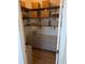 Well-organized pantry with wooden shelves, woven baskets, and a white cabinet offering ample storage space at 558 Pendleton Dr, Moncks Corner, SC 29461