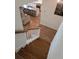 View of the wood staircase leading down from the main floor, open to the kitchen and living room at 558 Pendleton Dr, Moncks Corner, SC 29461