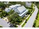 Aerial view of a luxurious neighborhood showcasing pristine homes, lush greenery, and a community pool at 566 Wading Pl, Daniel Island, SC 29492
