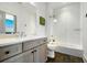 Modern bathroom featuring a vanity, a large mirror, a commode, and a glass shower enclosure at 566 Wading Pl, Daniel Island, SC 29492