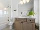 Bright bathroom featuring a shower, toilet, and vanity with modern fixtures at 566 Wading Pl, Daniel Island, SC 29492
