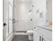 Modern bathroom with a glass-enclosed shower, white subway tile, and black fixtures for a sleek look at 566 Wading Pl, Daniel Island, SC 29492