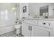 Modern bathroom with subway tile, glass shower, and geometric tile flooring at 566 Wading Pl, Daniel Island, SC 29492