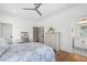 Bright bedroom featuring a bed, dresser, makeup table, and adjoining bathroom at 566 Wading Pl, Daniel Island, SC 29492