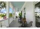 Spacious front porch with rocking chairs, a blue ceiling, and views of the neighborhood at 566 Wading Pl, Daniel Island, SC 29492