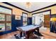 Inviting game room featuring a billiard table, hardwood floors, with wainscoting and bright windows at 566 Wading Pl, Daniel Island, SC 29492