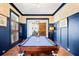 Inviting game room featuring a billiard table, hardwood floors, wainscoting and a bright window at 566 Wading Pl, Daniel Island, SC 29492