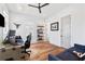 Well-lit home office with desk, shelving, and comfortable seating at 566 Wading Pl, Daniel Island, SC 29492