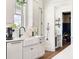 Bright and airy kitchen with white countertops, a farmhouse sink, and plenty of cabinet space at 566 Wading Pl, Daniel Island, SC 29492