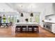 Modern kitchen with a large center island, stainless steel appliances, and open to the dining area at 566 Wading Pl, Daniel Island, SC 29492