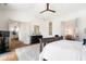 Open bedroom featuring hardwood floors, white walls, and abundant natural light from open doorways at 566 Wading Pl, Daniel Island, SC 29492