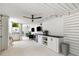 Expansive outdoor living area with modern amenities, including a TV and built-in cabinets at 566 Wading Pl, Daniel Island, SC 29492