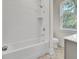 A bright bathroom featuring subway tile, modern fixtures, and a window that brings in natural light at 615 Du Bois Dr, Johns Island, SC 29455