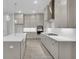 A modern kitchen featuring gray cabinets, stainless steel appliances, and a central island with white countertops at 615 Du Bois Dr, Johns Island, SC 29455