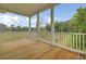 This expansive porch features wood floors and classic white railings at 615 Du Bois Dr, Johns Island, SC 29455