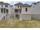 View of backyard with stairs to screened porch and the house's exterior at 619 Du Bois Dr, Johns Island, SC 29455