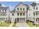 Charming two-story home with a quaint front porch, driveway, and manicured landscaping at 619 Du Bois Dr, Johns Island, SC 29455