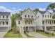 Charming two-story home with a quaint front porch, driveway, and manicured landscaping at 619 Du Bois Dr, Johns Island, SC 29455