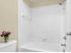 A clean, bright bathroom with a white tile shower/tub combo and simple decor at 700 Daniel Ellis Dr # 3108, Charleston, SC 29412