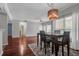 Open-concept dining room features modern lighting, hardwood floors and a dining table set at 700 Daniel Ellis Dr # 3108, Charleston, SC 29412