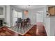 Bright dining area with hardwood floors and natural light from a window, along with dining table set at 700 Daniel Ellis Dr # 3108, Charleston, SC 29412