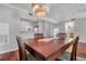 Inviting dining room features a stylish chandelier and rich hardwood floors at 700 Daniel Ellis Dr # 3108, Charleston, SC 29412
