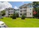 Lovely condo building with well-maintained lawn and inviting balconies on a bright day at 700 Daniel Ellis Dr # 3108, Charleston, SC 29412