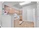 Bright kitchen features tile floor, white appliances, and view into living area at 700 Daniel Ellis Dr # 3108, Charleston, SC 29412