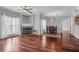 Open-concept living room with hardwood floors, a fireplace, and natural light at 700 Daniel Ellis Dr # 3108, Charleston, SC 29412