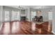 Open-concept living room with hardwood floors, fireplace, and natural light from a sliding glass door at 700 Daniel Ellis Dr # 3108, Charleston, SC 29412