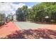 Community tennis court in a wooded area providing an amenity for residents with a place to play at 700 Daniel Ellis Dr # 3108, Charleston, SC 29412