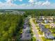 This aerial shot showcases a well-planned neighborhood surrounded by lush trees at 704 Kilarney Rd, Summerville, SC 29483
