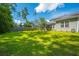 Well-maintained backyard featuring green grass and a swing set, great for outdoor play at 704 Kilarney Rd, Summerville, SC 29483