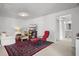 A finished basement offers a flexible living space, including a TV, seating and play area at 704 Kilarney Rd, Summerville, SC 29483