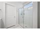 Bathroom featuring a glass enclosed shower, tile flooring, and a white door at 704 Kilarney Rd, Summerville, SC 29483