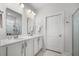 A full bathroom with a double sink vanity, modern fixtures and a glass enclosed shower at 704 Kilarney Rd, Summerville, SC 29483