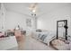 Bright bedroom features a day bed, ceiling fan, and a cute pink desk at 704 Kilarney Rd, Summerville, SC 29483