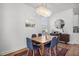 Cozy dining room featuring a wood table, six chairs, and a unique chandelier at 704 Kilarney Rd, Summerville, SC 29483