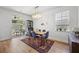 Bright dining room with a chandelier, a wooden table, and a view to the exterior at 704 Kilarney Rd, Summerville, SC 29483