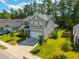 Home exterior with a two-car garage, well-manicured lawn, and a welcoming entrance at 704 Kilarney Rd, Summerville, SC 29483