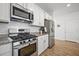 Well-equipped kitchen featuring stainless steel appliances and white cabinetry for a clean look at 704 Kilarney Rd, Summerville, SC 29483