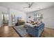 Cozy living room featuring plush sofas, a modern TV stand, and stylish decor, creating a relaxed ambiance at 704 Kilarney Rd, Summerville, SC 29483