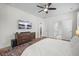 A well-lit main bedroom features a TV, dresser, and a door to the bathroom and closet at 704 Kilarney Rd, Summerville, SC 29483