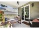 Inviting outdoor patio with comfortable seating, a ceiling fan, and a sliding glass door at 704 Kilarney Rd, Summerville, SC 29483