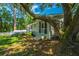 The backyard features a well-maintained lawn, and there is a large tree providing shade for the home at 734 Waterloo St, Charleston, SC 29412